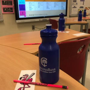 Carolina Bank water bottles and Flamingos items inside local school classroom.