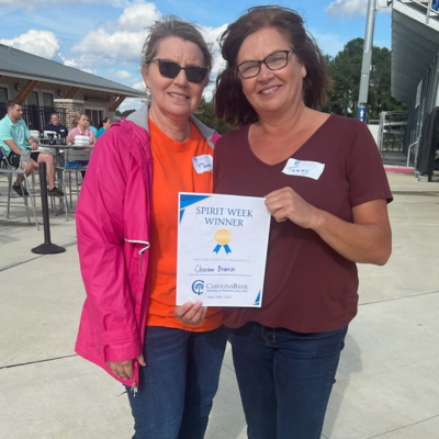 Cheraw branch employees holding up their Spirit Week "Winner" certificate.