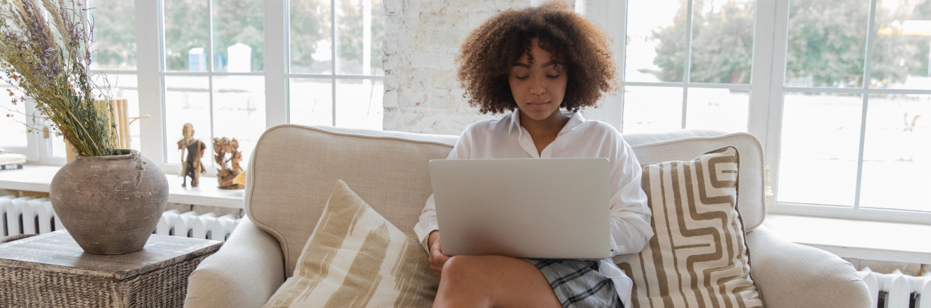 Woman Cross Legged with Laptop on Lap