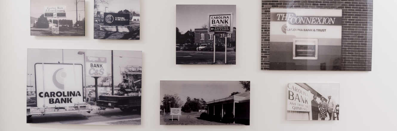 Wall of historic photos from Carolina Bank's HQ