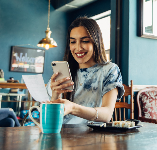 A young woman holding a smart phone