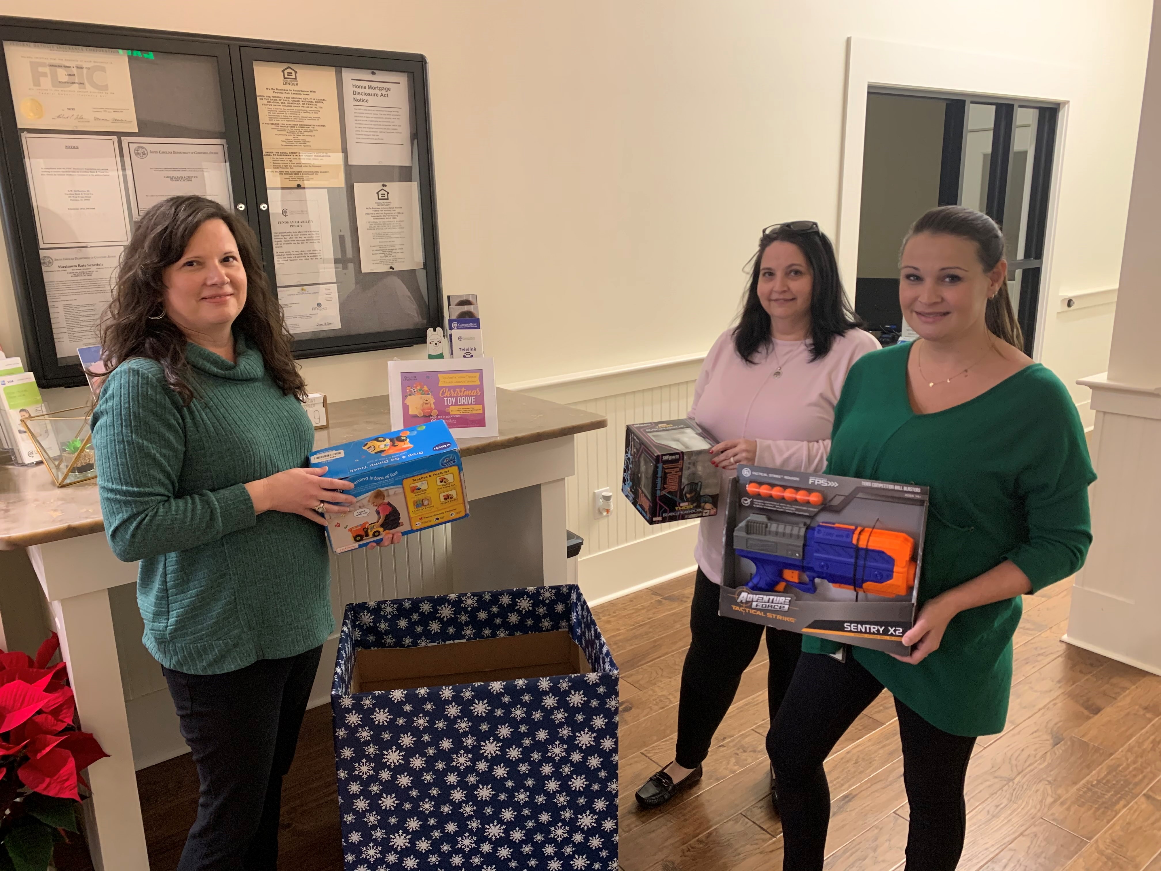 Carolina Bank employees donating toys at the Evans branch. 