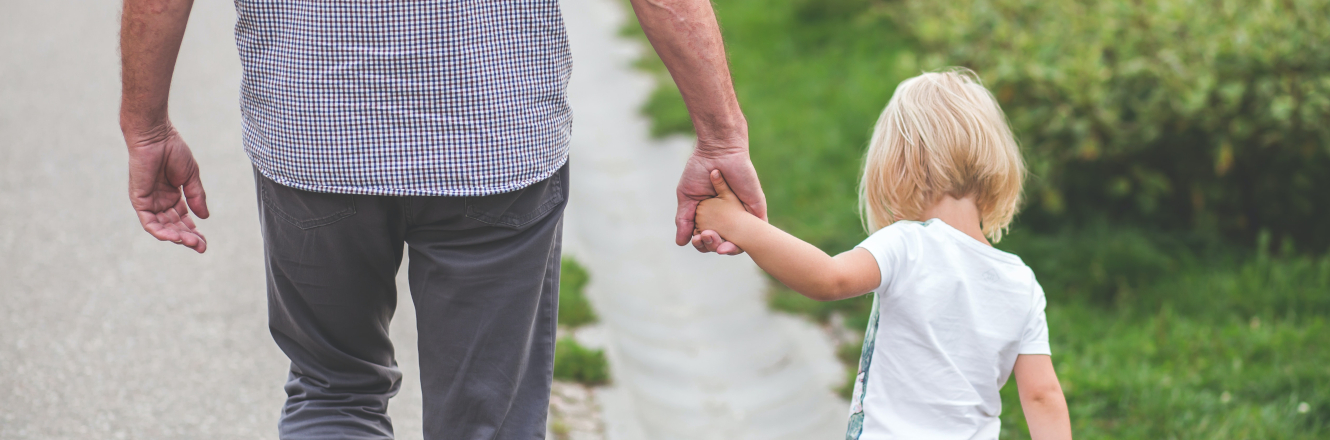 grandparent and grandchild walking and holding hands